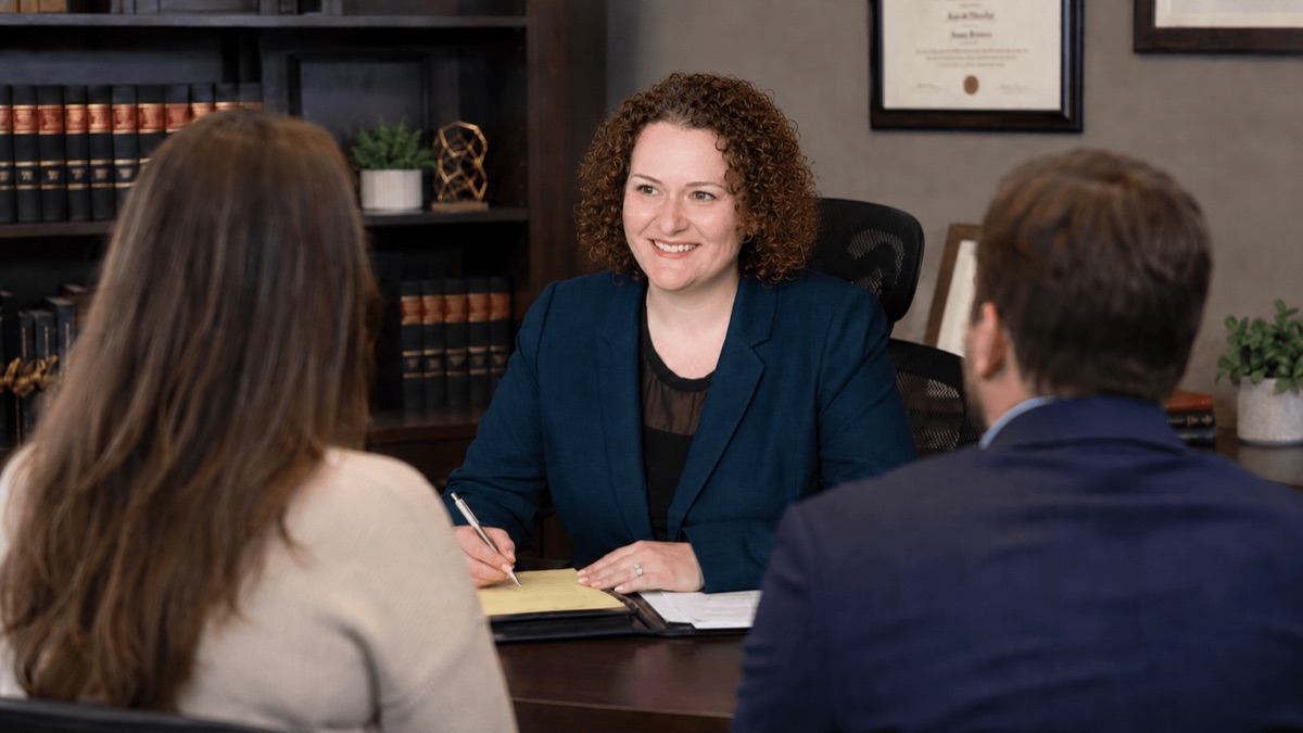 Ann Fabrikant meeting with clients at Fabrikant Law